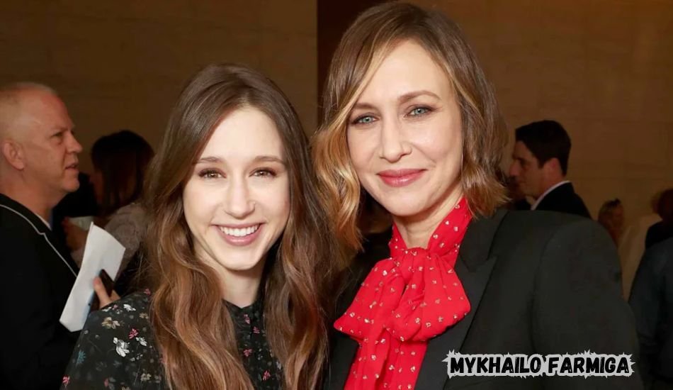 Mykhailo Farmiga smiling at an event in a formal suit