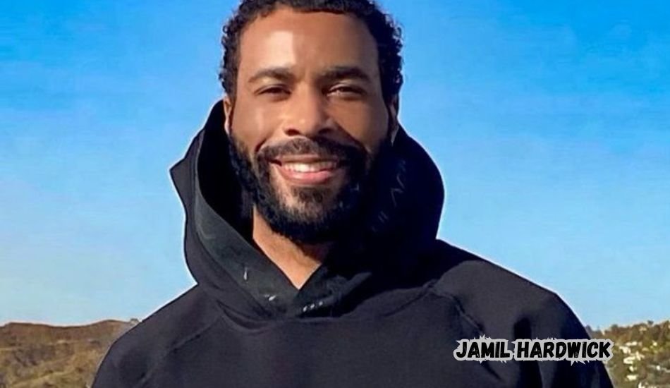 Jamil Hardwick smiling in a casual suit at an event