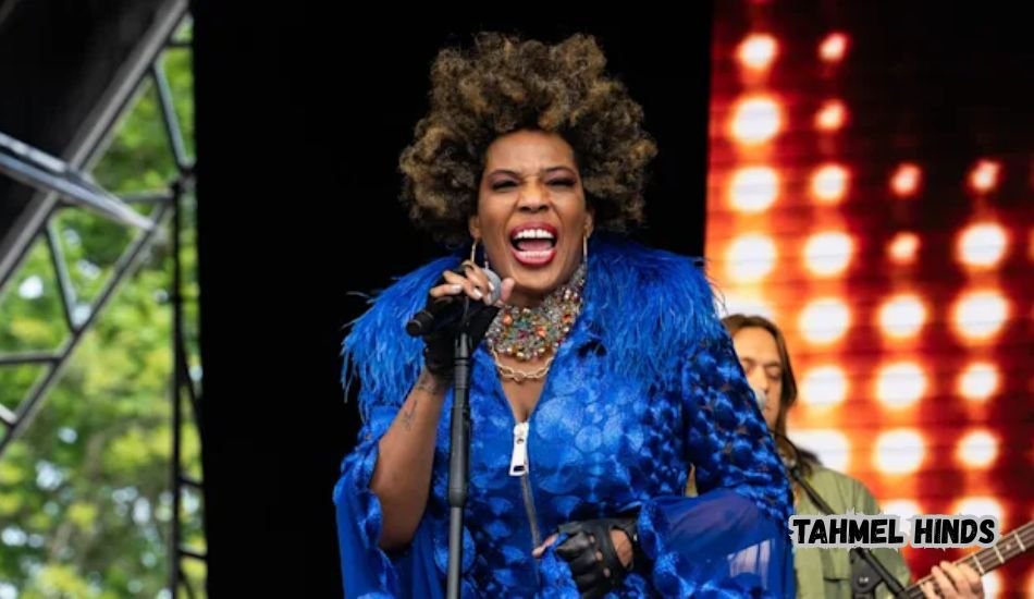 Tahmel Hinds smiling during a public appearance.