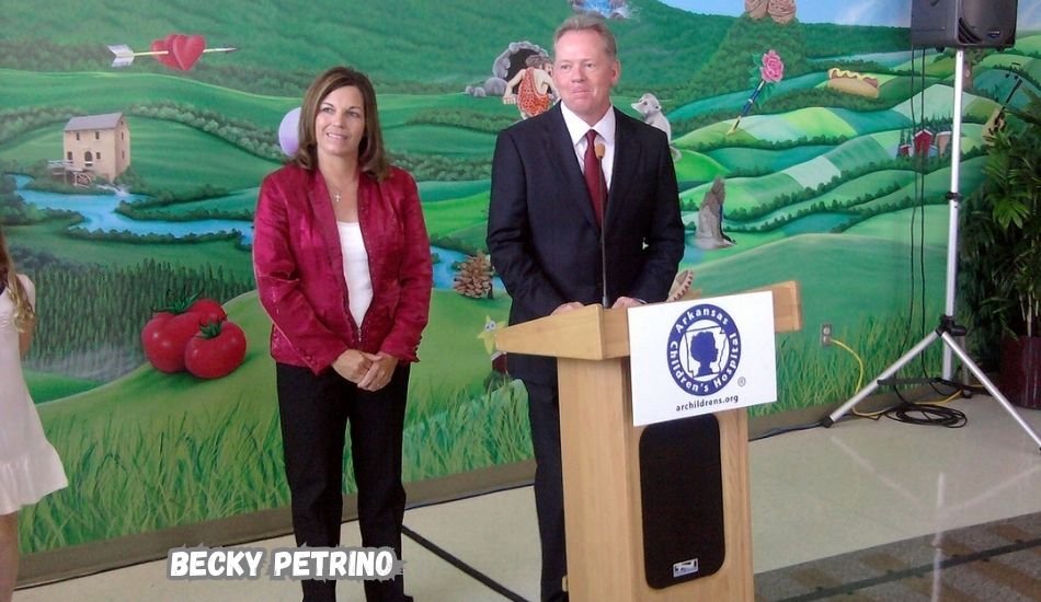 Becky Petrino attending a football game with her family.